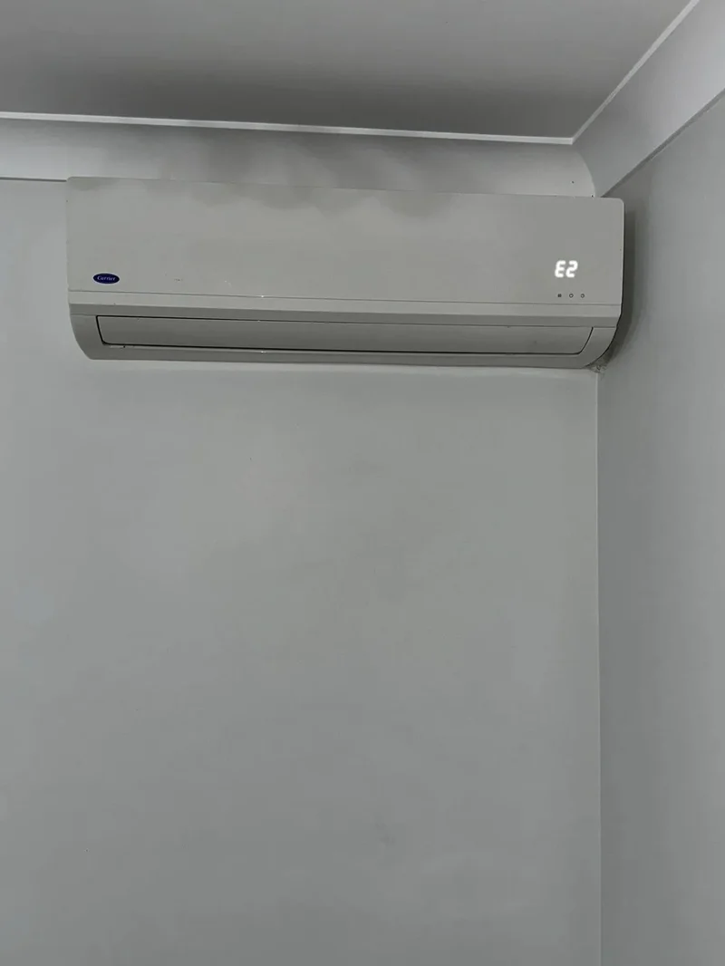 Split system indoor unit fitted flush to the wall in a freshly painted room