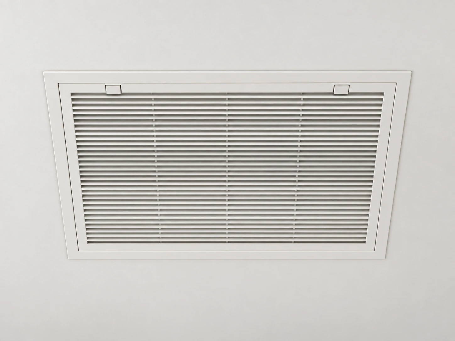 White return-air grille fitted into a ceiling