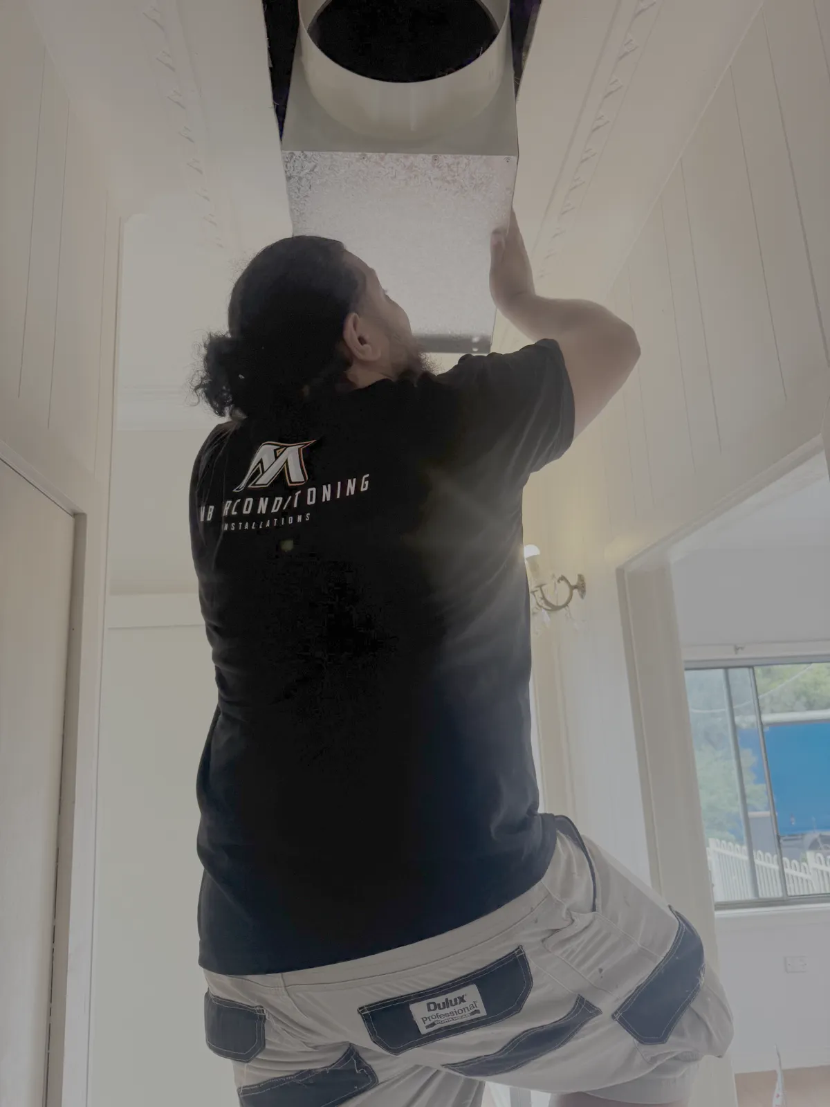Technician servicing an indoor unit